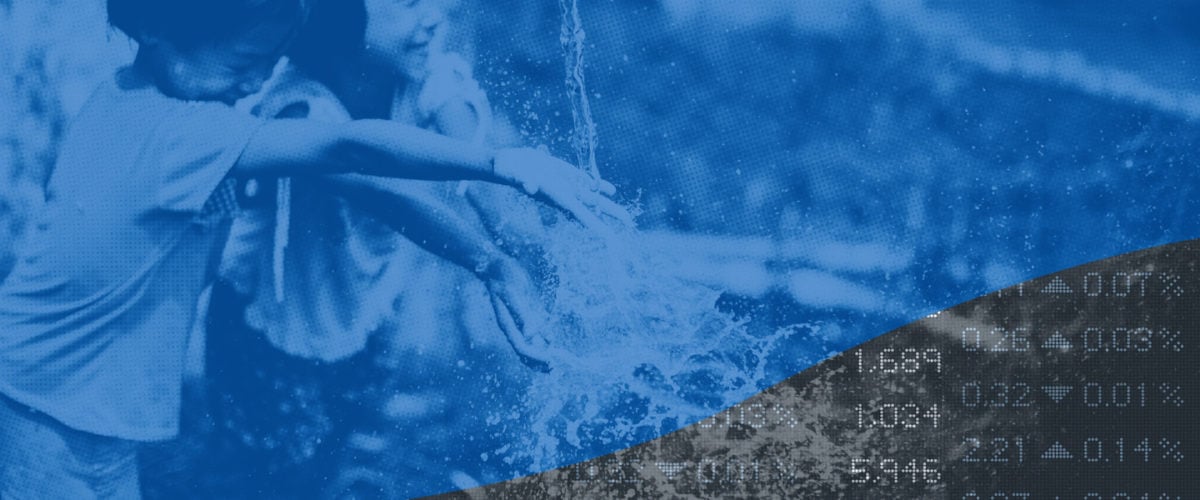 Two children play under a water faucet. In the bottom right corner, we see an array of numbers from stock tickers.