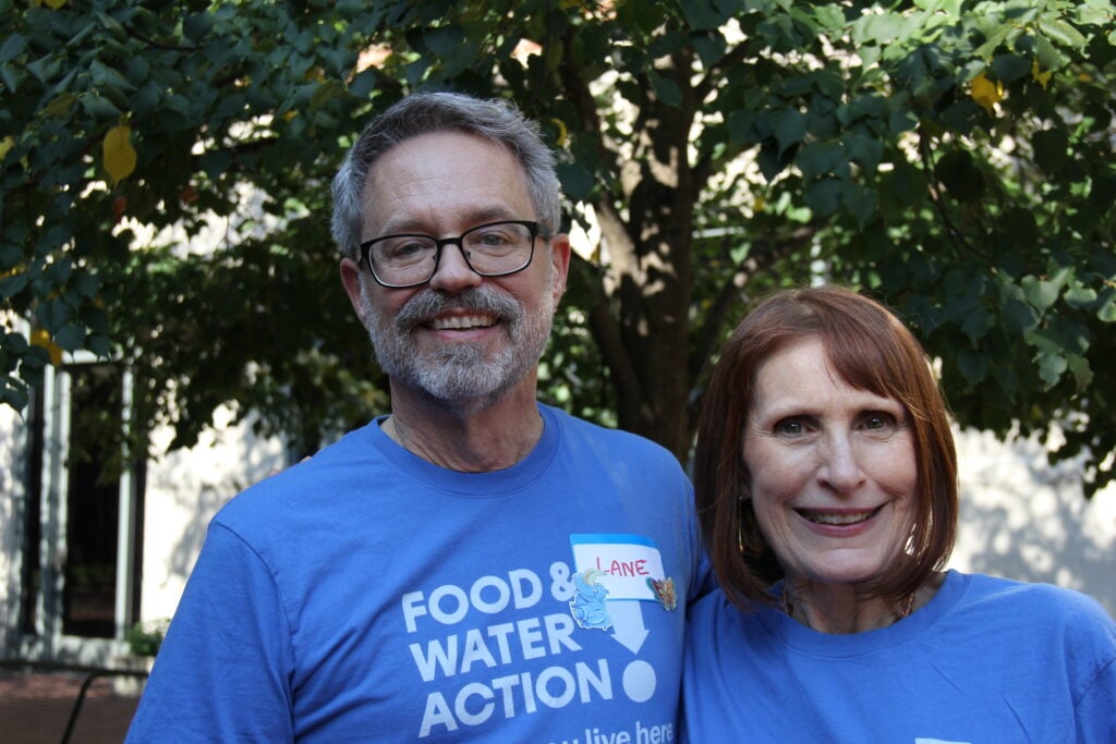 Lane and Wenonah stand side-by-side wearing matching blue Food & Water Action t-shirts.