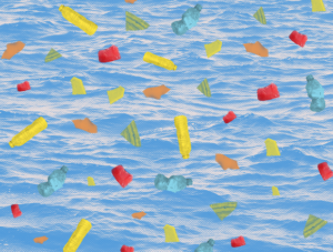 Colorful shards of microplastics on watery background.