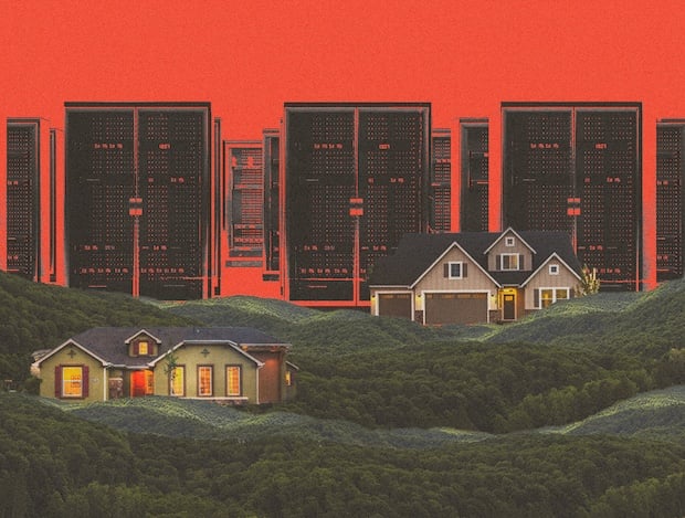 Data center servers loom over a pair of houses.